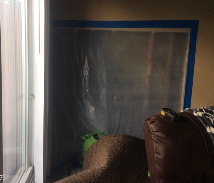 Plastic covering removed wall 